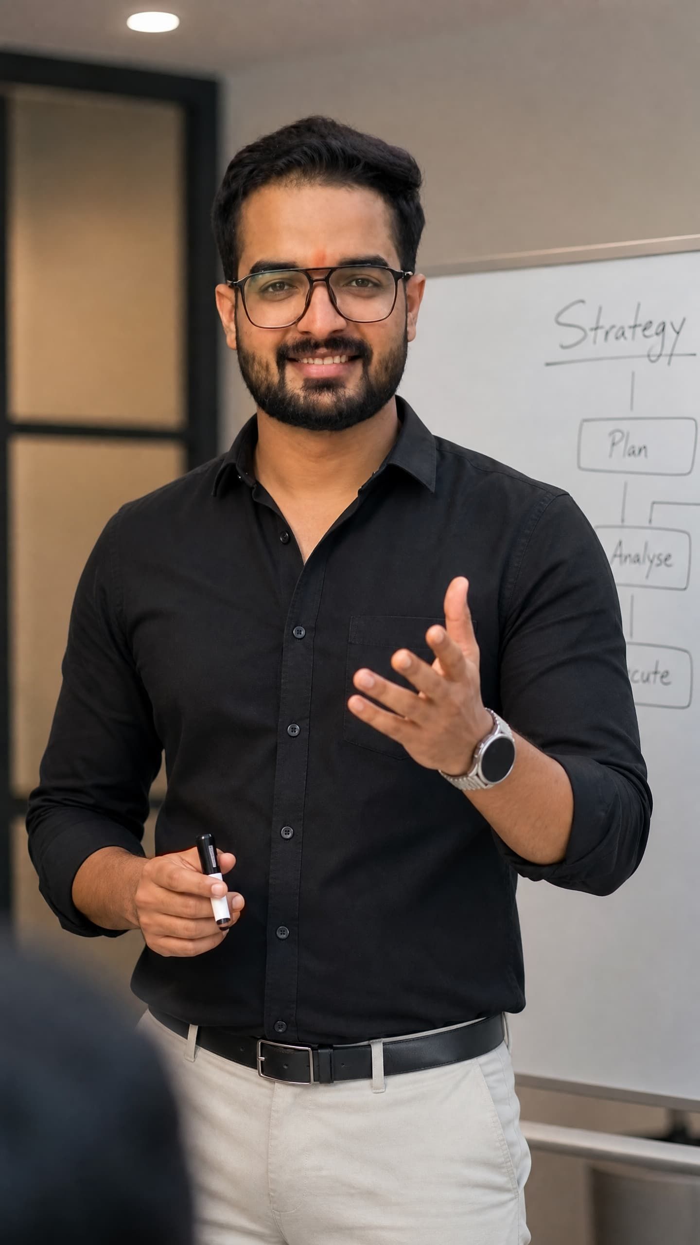 Priyanshu at a whiteboard, working through strategy